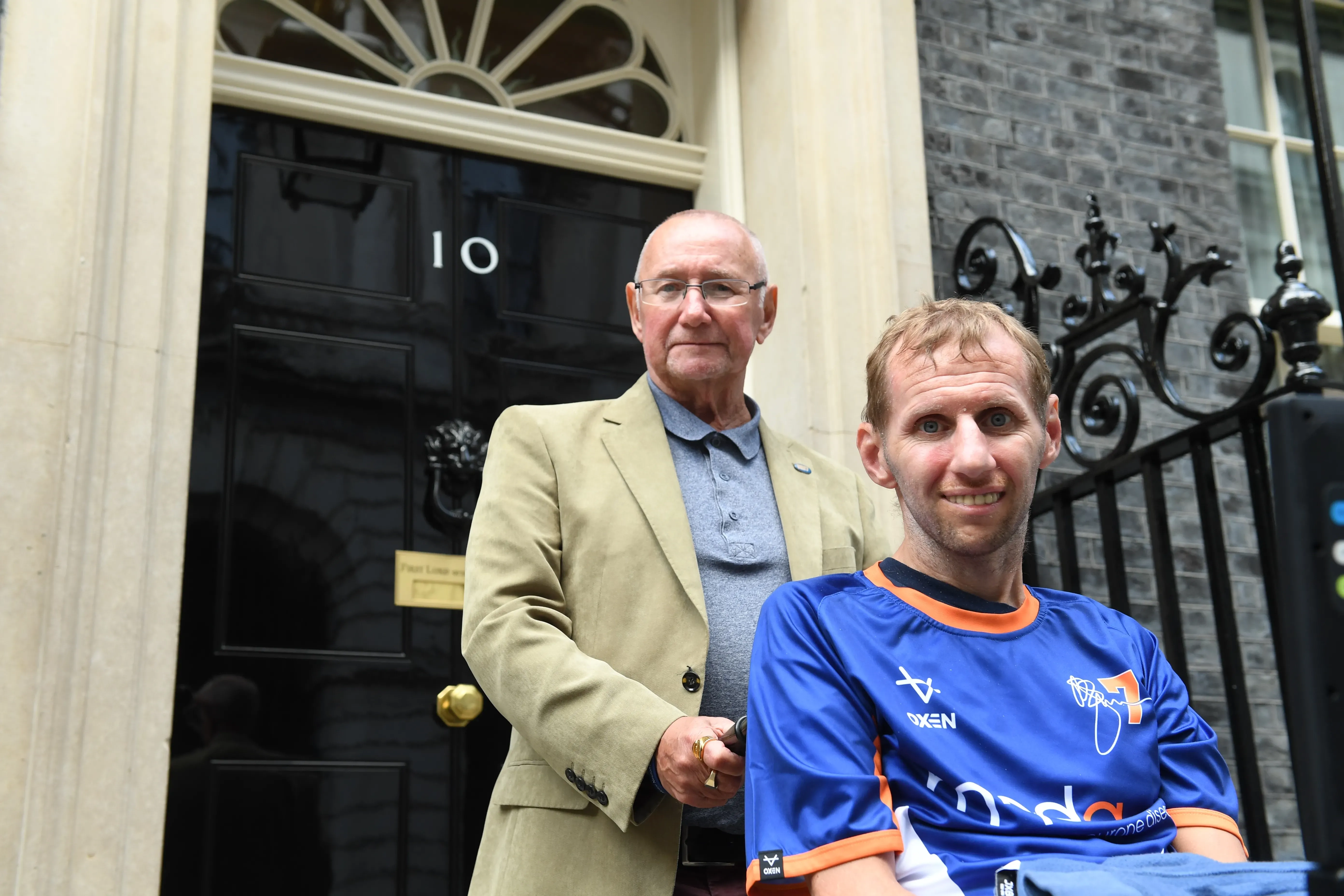 Rob and his dad Geoff Burrow outside 10 Downing Street.