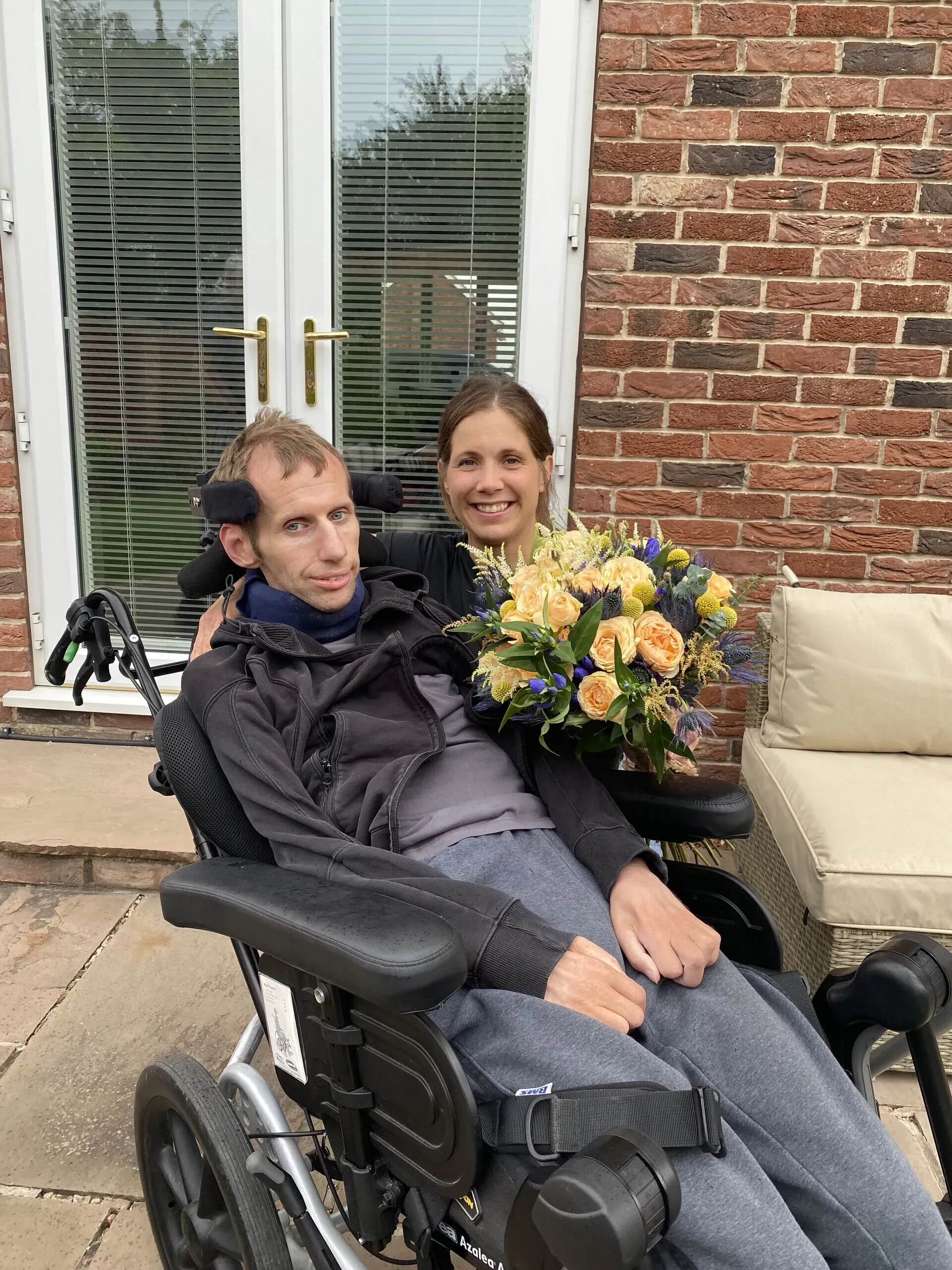 Rob and Lindsey receiving their Rob Burrow MND rose which raises funds for the Association